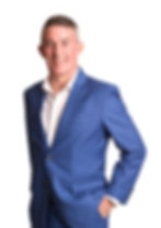 Jo Lodder in a blue suit – record-breaking ultra-runner, former jockey and sought-after keynote speaker on resilience, mindset and high performance. Speaking across Hong Kong, Singapore, UK, USA and Australia.