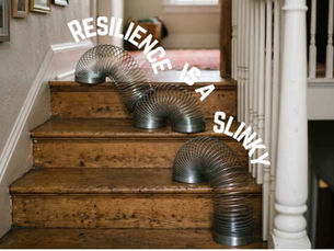 A Slinky toy flexibility navigating down a set of stairs, illustrating Jo Lodder’s keynote analogy: 'Resilience is like a Slinky.' The image symbolizes a leader’s dynamic adaptability, showing that building winning teams requires bending without breaking, maintaining momentum, and moving forward 'no matter the conditions.
